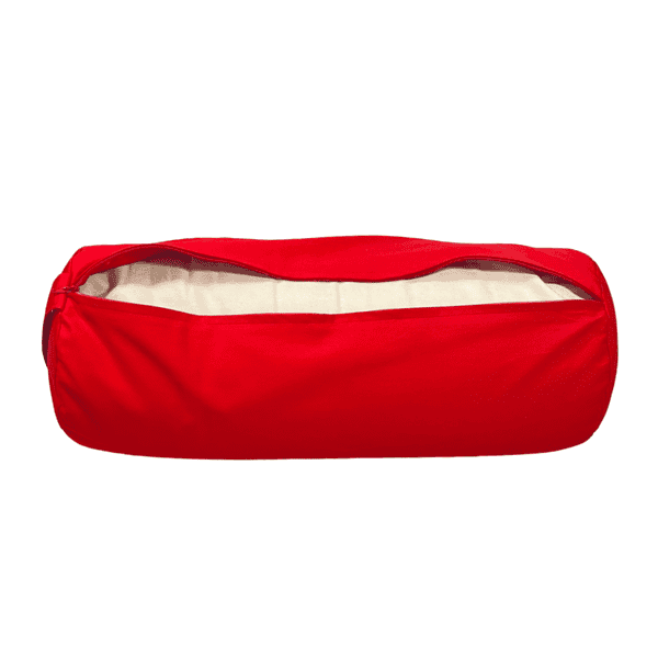 A scarlet red bolster unzipped showing the inner casing containing buckwheat