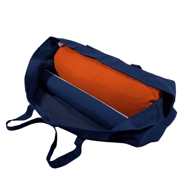 The kit bag holds a standard bolster and a yoga mat